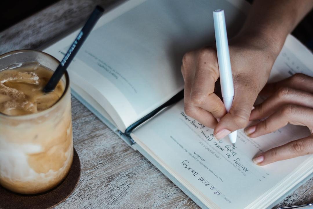 Person writing in a journal