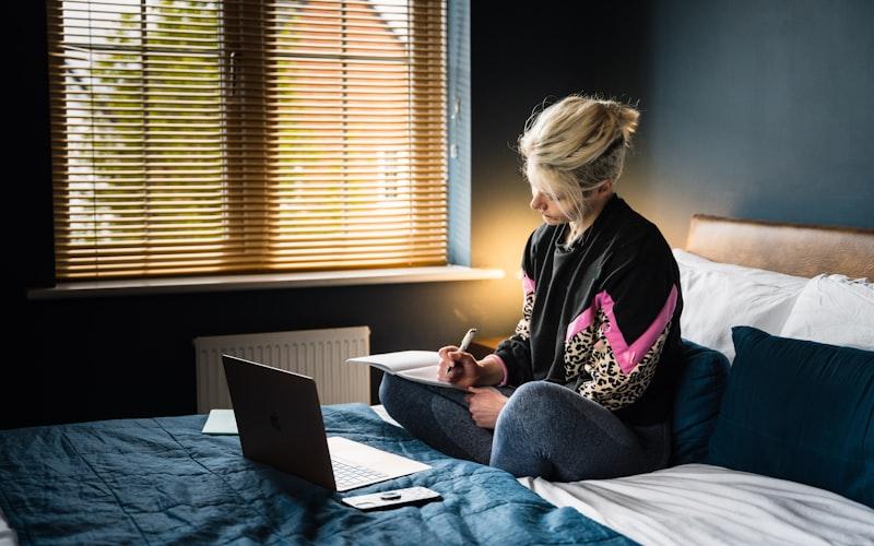 Woman journaling in a cozy setting