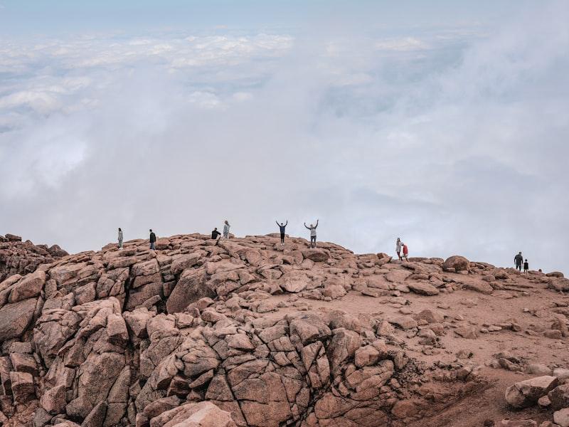 Hikers celebrating on a mountain summit